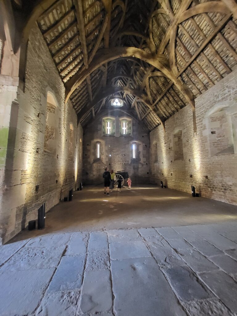 Interior of the large 14th-century Abbey Barn at Somerset Rural Life Museum, once used for storing hay and grain