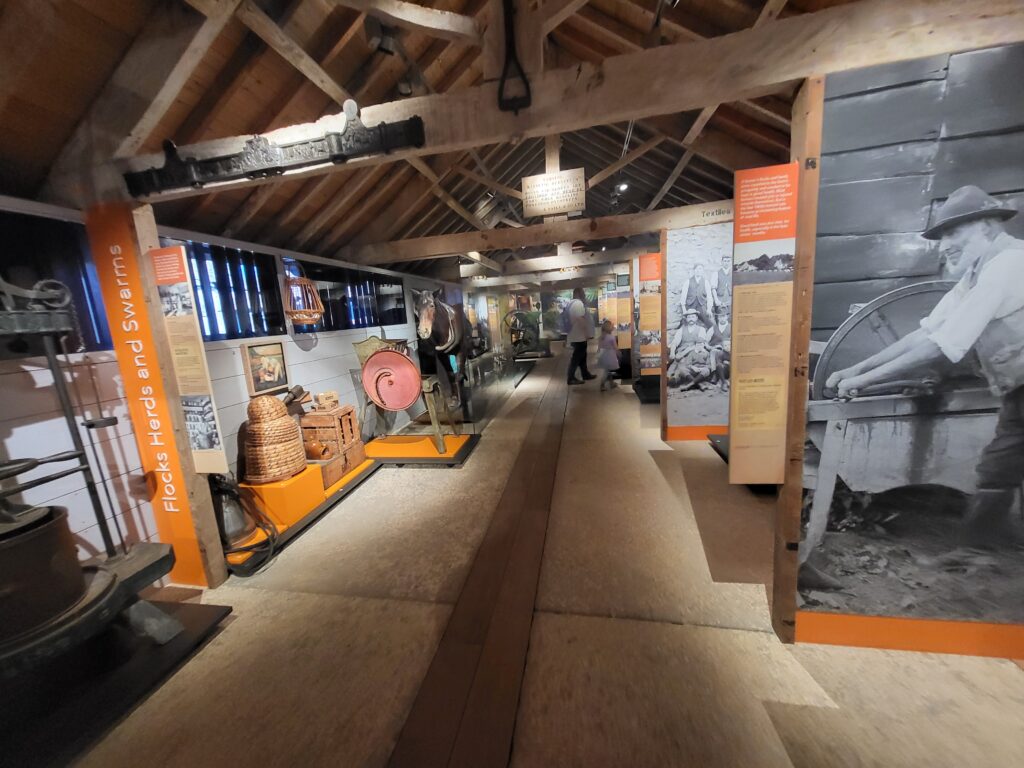 Exhibition inside Somerset Rural Life Museum telling the life story of farm worker John Hodges from cradle to grave