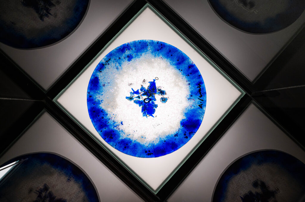 Painted glass plate by Andrej Jemec displayed in Čop’s Birth House exhibition