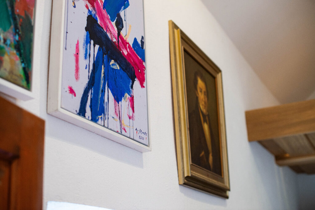 Portrait of Matija Čop from the permanent collection next to an abstract painting by Andrej Jemec