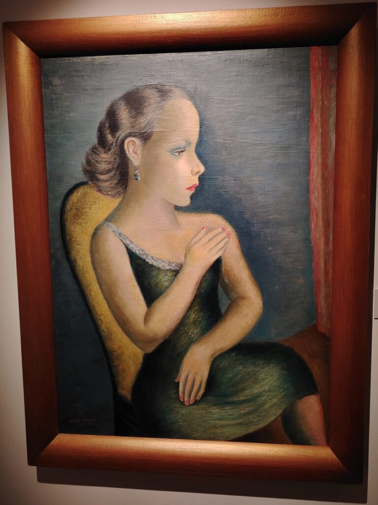 Portrait of a woman by Slovenian artist Veno Pilon displayed on the wall in Pilon Gallery Ajdovščina.
