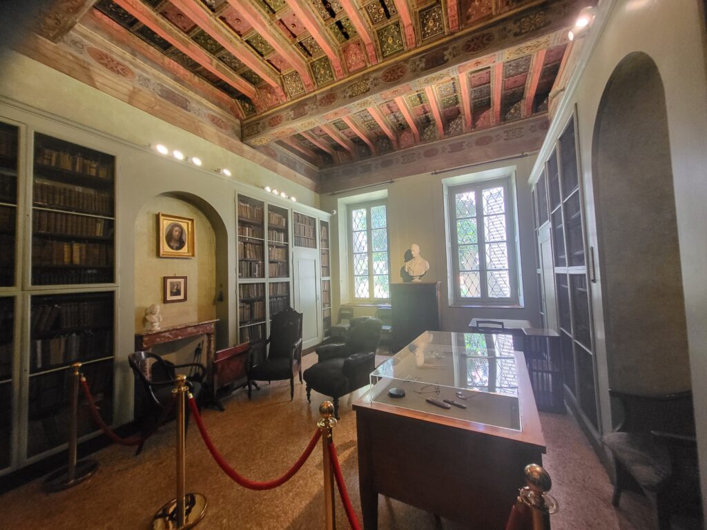 Study room of Alessandro Manzoni with desk, chairs and books in Manzoni House Milan