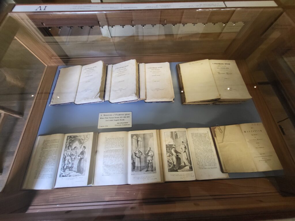 Display case with different editions of The Betrothed by Alessandro Manzoni in Manzoni House Milan