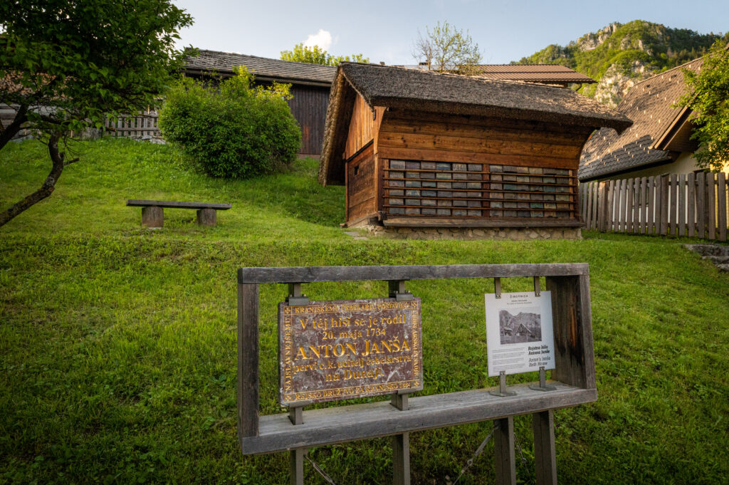 Memorial plaque from Anton Janša’s demolished birth house displayed in front of Janša’s Apiary in Breznica
